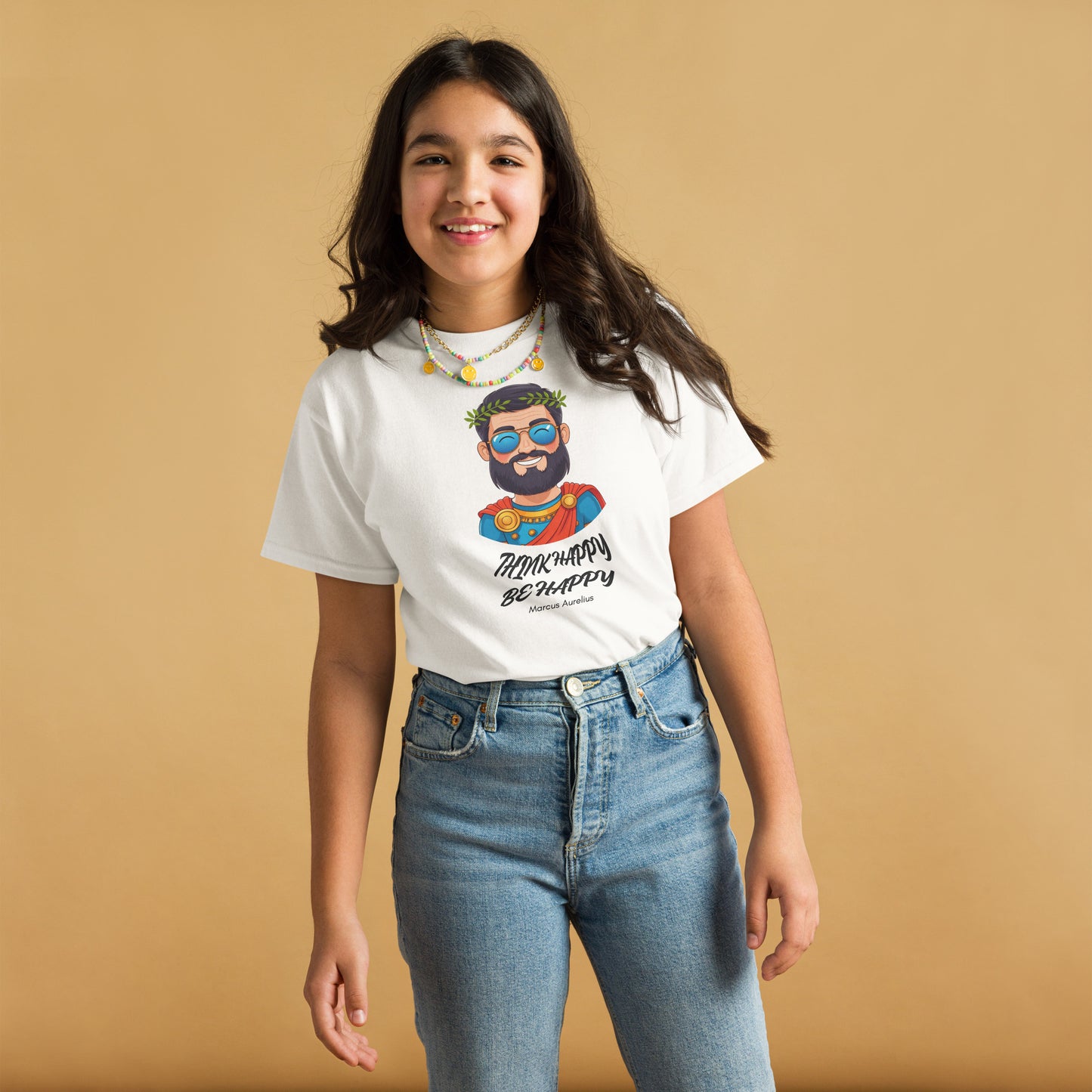 Person wearing a white t-shirt with a graphic design on a beige background