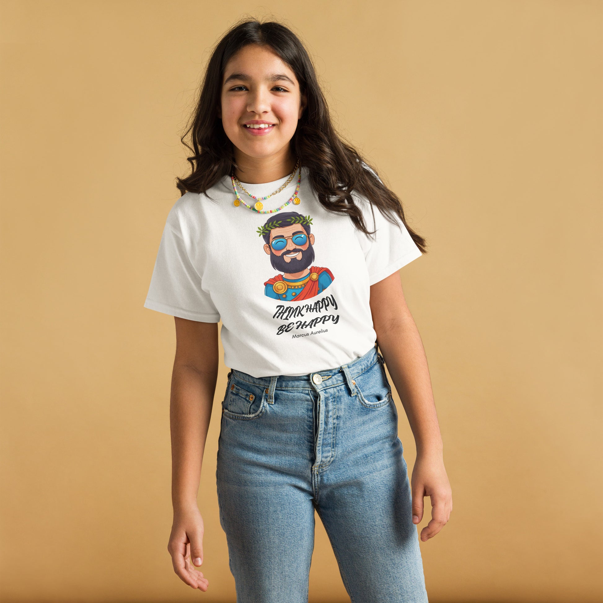 Person wearing a white t-shirt with a graphic design on a beige background